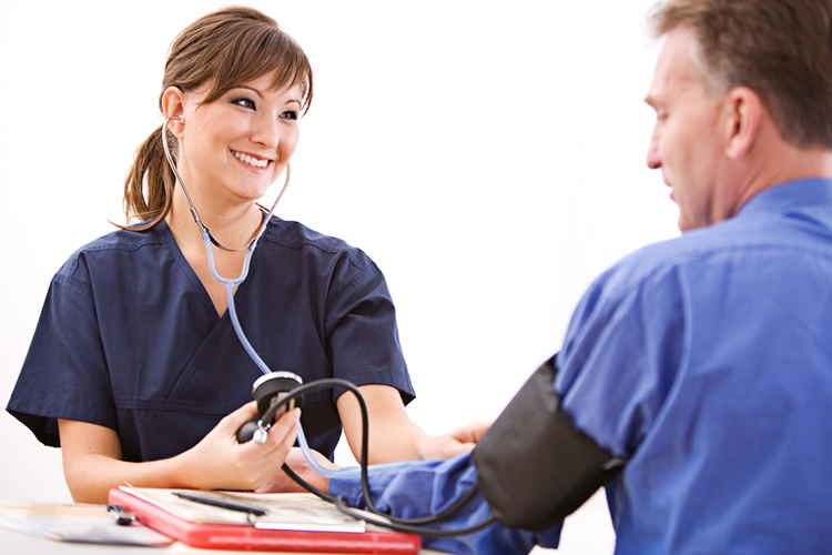 Nurse taking blood pressure