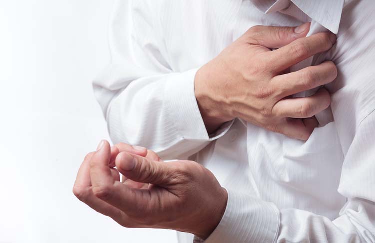 Person experiencing cardiac symptoms