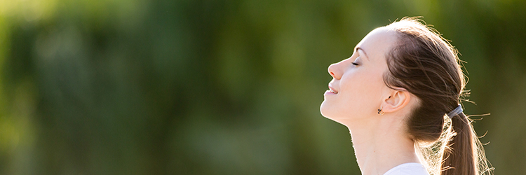 Person practicing healthy breathing techniques