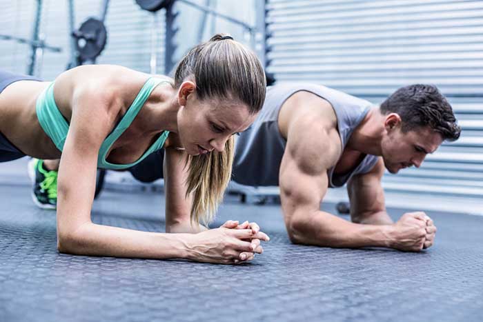 Personal trainer working with a client, illustrating coaching principles