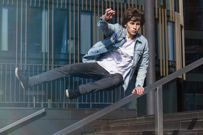 Teenagers practicing parkour in an urban environment