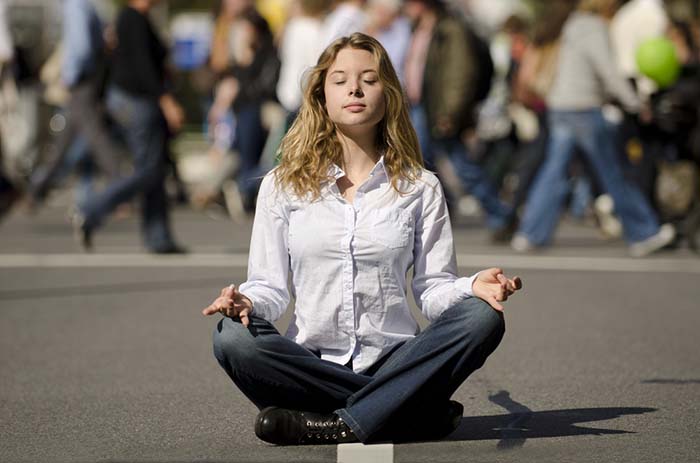 Person practicing relaxation in an everyday setting